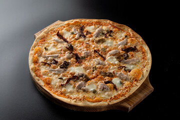 Plain chicken and mushroom pizza with melted cheddar cheese on a thin dough, light dietary pizza