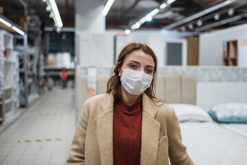 Portrait of beautiful girl wearing protective medical mask