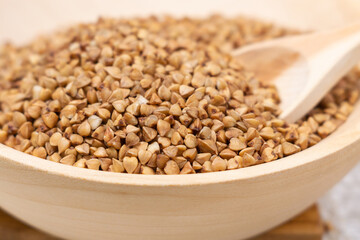 Buckwheat grain dry buckwheat. Close-up of brown buckwheat groats. Healthy food.