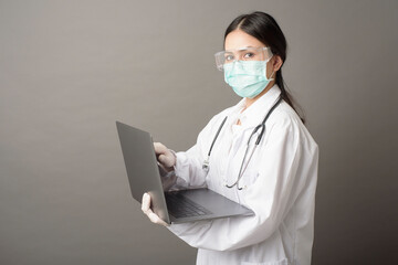  Woman Doctor is using  laptop