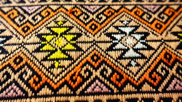 4K More than 100 years old colorful thai handcraft peruvian style rug surface old vintage torn conservation Made from natural materials Chemical free close up