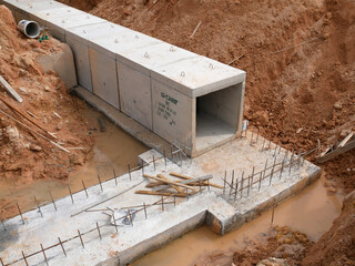 SELANGOR, MALAYSIA -JANUARY 19, 2020: Underground precast concrete box culvert drain under construction at the construction site. It is used to channel stormwater to the nearest monsoon drain.  - obrazy, fototapety, plakaty