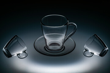 glassware for tea mulled wine coffee illuminated by light from below on frosted glass