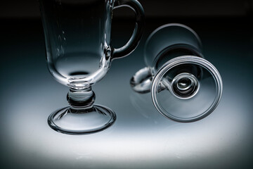 glassware for tea mulled wine coffee illuminated by light from below on frosted glass