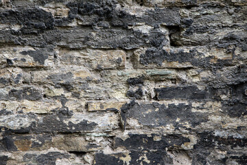 Background and texture of an old stone wall close up