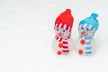 Decorative snowmen on the slope. Concept, winter has come, snowy winter, holidays.There is a place for your text