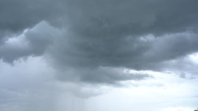 Video time lapse of dark grey dramatic cloudy rainy sky