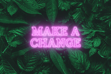Neon pink lettering: make a change, on a green natural background. Concept for motivating background, business, self-development.