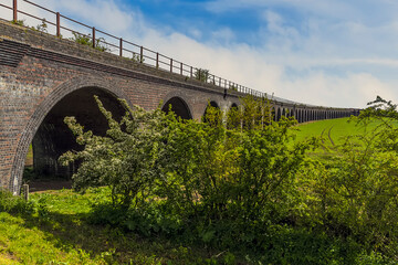 Fototapeta na wymiar A view along the length of the abandoned railway viaduct at Fledborough, Nottinghamshire in springtime