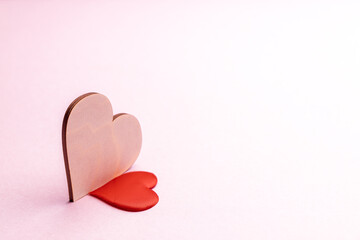 valentine day and romance concept. love symbol over pastel pink background. greeting card. two hearts composition