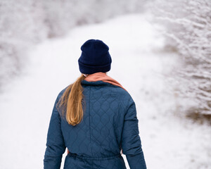 Woman walking in the snow