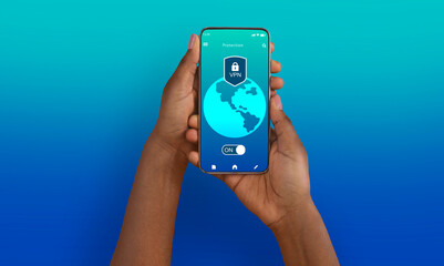 Black woman holding and using cellphone with vpn app