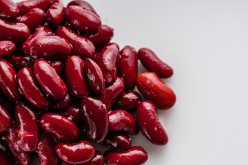 canned red kidney beans on a white acrylic background