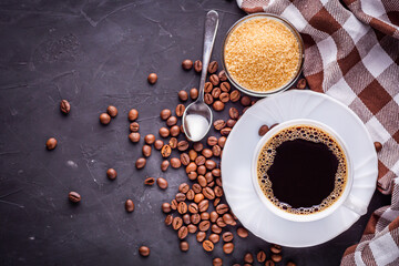 Obraz na płótnie Canvas cup of fragrant fresh coffee on a dark stone background
