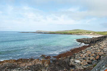Fototapeta na wymiar Rocky coastline of the Atlantic Ocean on Barra Island, in the Outer Hebrides, Scotland, UK