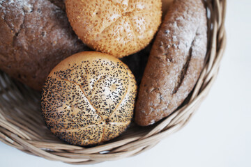 Homemade for Bakery and golden crusty breads in basket isolated on white background.