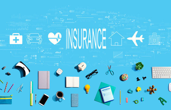 Insurance concept with collection of electronic gadgets and office supplies