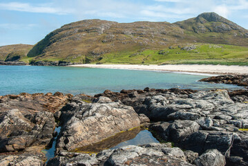 White sandy beach on the shore of  the Atlantic Ocean on Barra Island, in the Outer Hebrides,...
