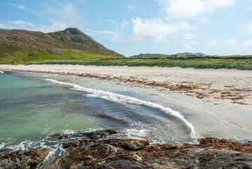 White sandy beach on the shore of  the Atlantic Ocean on Barra Island, in the Outer Hebrides, Scotland, UK
