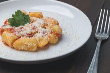 gnocchi with ragù  in white porcelain plate