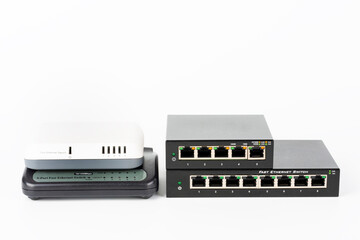 Three  slower  10 or 100 Mbps Fast Ethernet switches and  5-port gigabit desktop switch. - obrazy, fototapety, plakaty