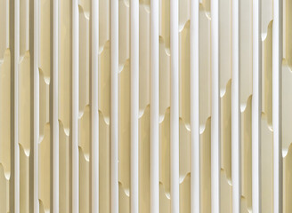 Yellow plastic wall panel with 3D effect. Background with a three-dimensional pattern.