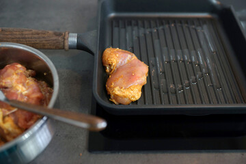 Spiced chicken thighs in a grill pan
