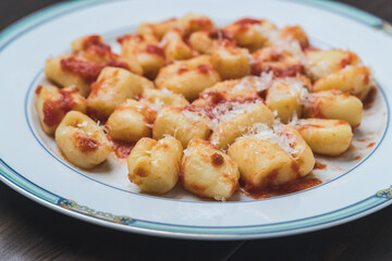 homemade gnocchi on wooden table