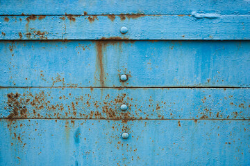 Texture of blue metal background with rust.