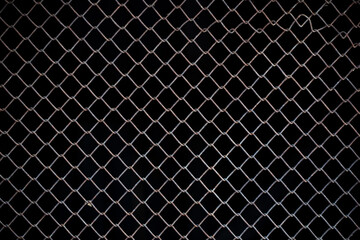 Texture of rusty iron mesh, on a black background