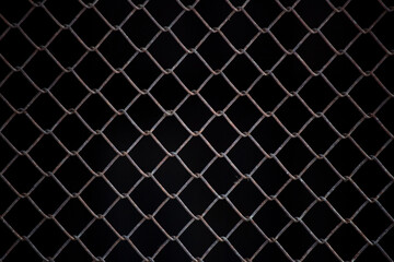 Texture of rusty iron mesh, on a black background