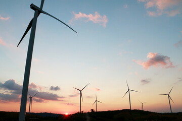 Silhouette of the wind turbine sunrise , Dan Khao Kho,Phetchabun, Thailand.	