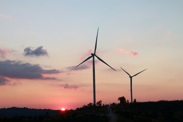 Silhouette of the wind turbine  sunrise , Dan Khao Kho,Phetchabun, Thailand.