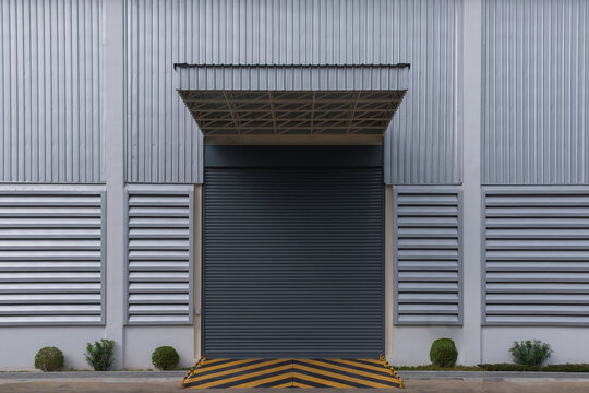 A closeup shot of automatic metal roller door used in factory, storage, garage, and industrial warehouse.Closed lock down CORVID 19 period