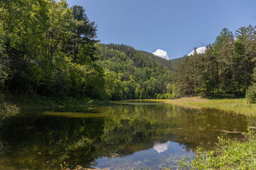 Obraz premium Landscape with a lake and mountains