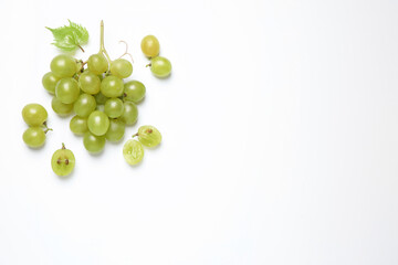 Bunch of fresh ripe green grapes with leaf on white background, top view