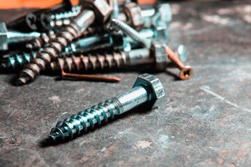 Group of screws on a table in a Workshop