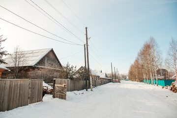 Fototapeta na wymiar Snowy winter in russian village. Siberia, frost