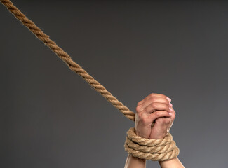 Woman's hands tied