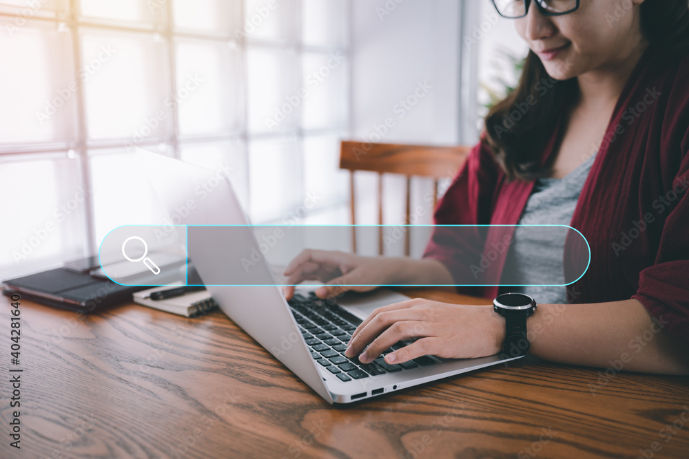 Aufkleber Searching Browsing Internet Data Information with blank search bar.Search Engine Optimization SEO Networking Concept.hand of woman working with computer laptop on desk in office.