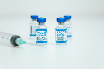 Covid-19 Corona Virus 2019-ncov vaccine vials medicine drug bottles syringe injection. Vaccination, immunization, treatment to cure Covid 19 Corona Virus infection. Healthcare And Medical concept.