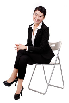 A young Business woman sitting on a chair 