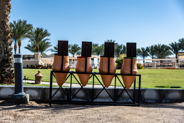 clay ceramic pots in the landscape interior of the park