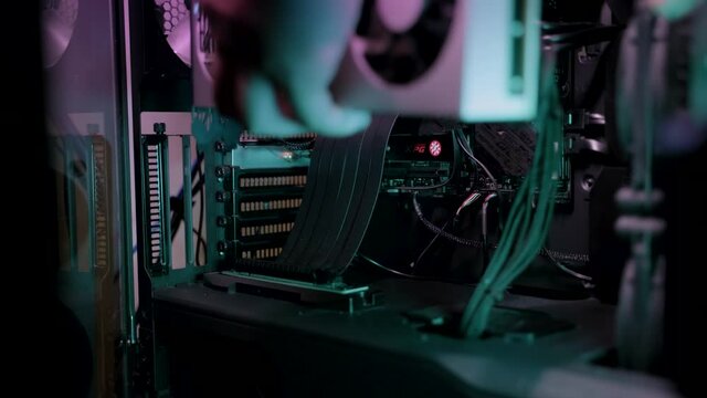 4K UHD Footage Of a man fixing and cleaning GPU card fans