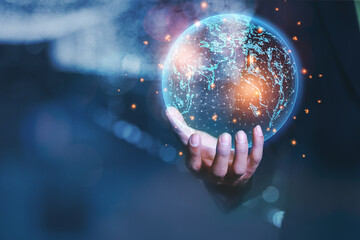 Business man wearing a suit and hands showing a global network of business graphics information...