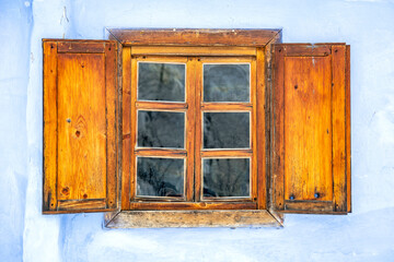Rustic old wooden window with shutters