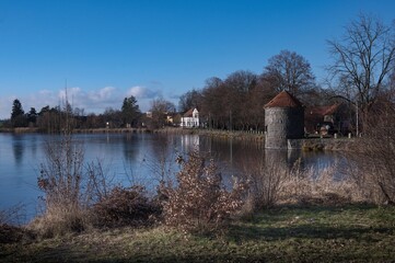 A quiet place to live by a pond in a small village.