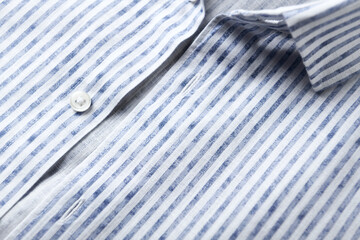 Fototapeta na wymiar Close up of men's striped shirt. Cotton fabric.