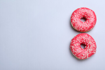 8 March greeting card design with donuts and space for text on light grey background, flat lay....