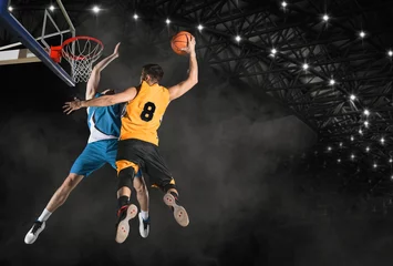Fotobehang Two basketball players in arena. Blocked shot © Andrey Burmakin